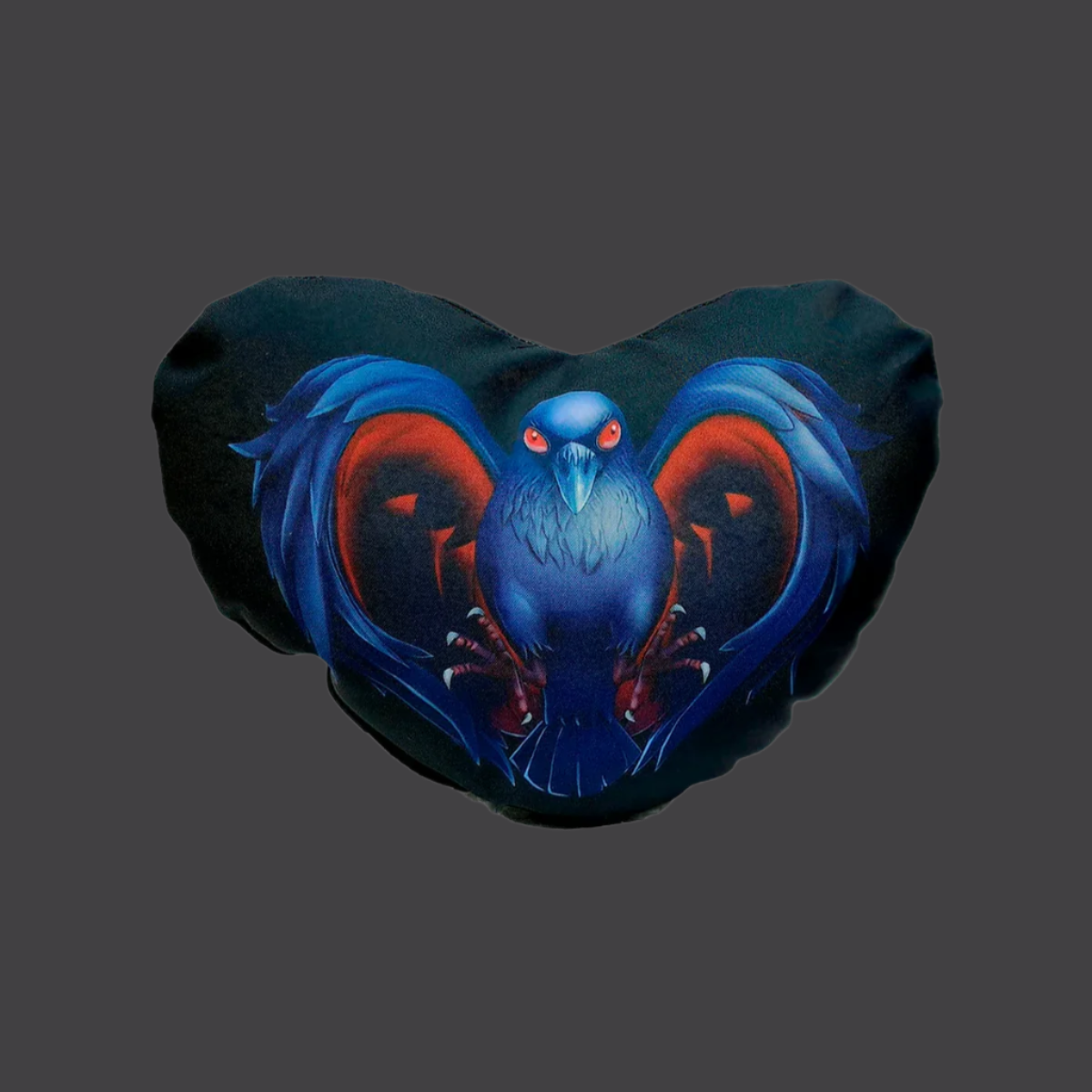 A heart-shaped pillow with a black background featuring a blue and red crow design.