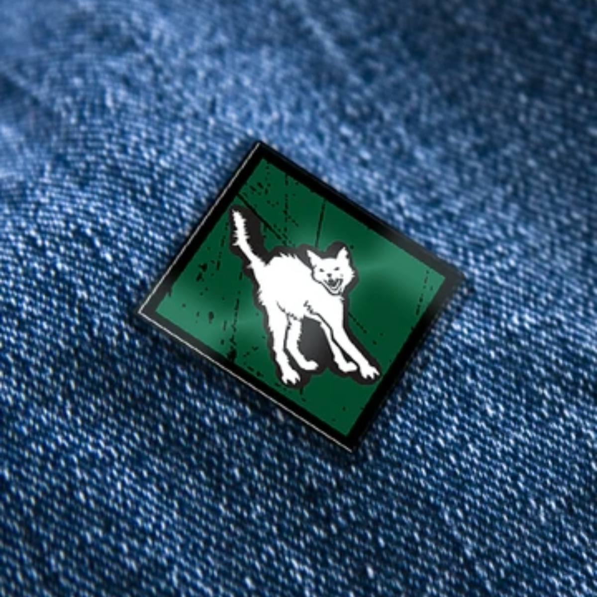 Cat pin on a denim background