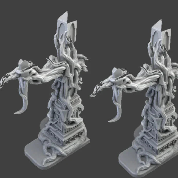 Two gray figurines with intricate designs on a black background