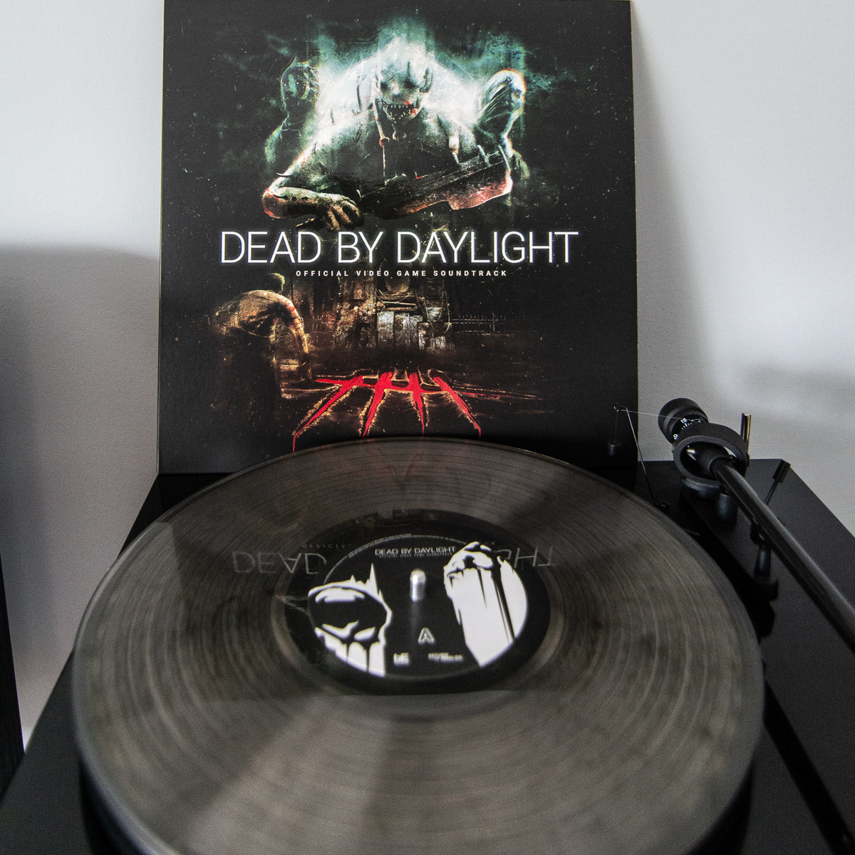 Vinyl record with 'Dead by Daylight' cover on a turntable